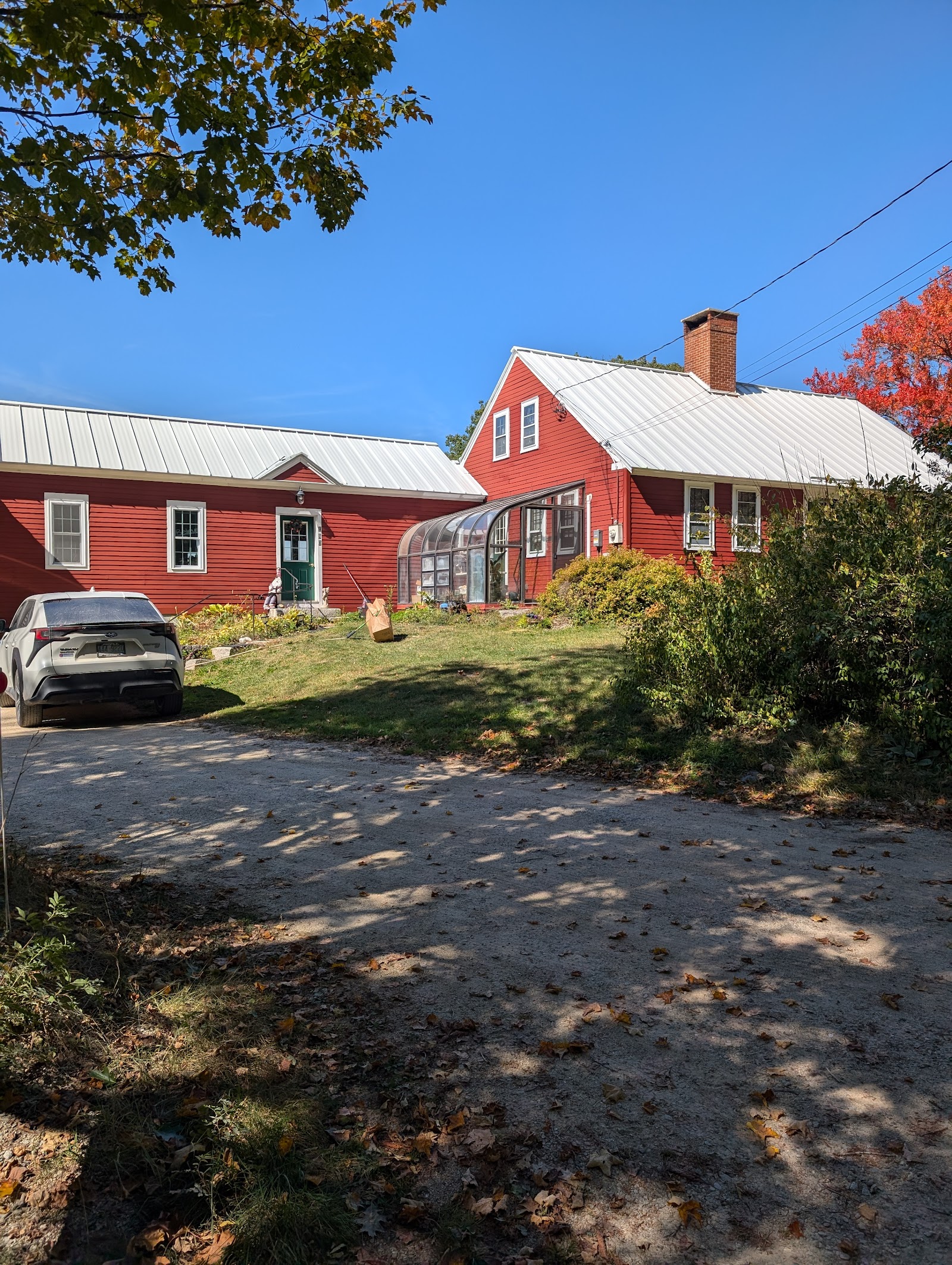Finished metal roof on a red New England home